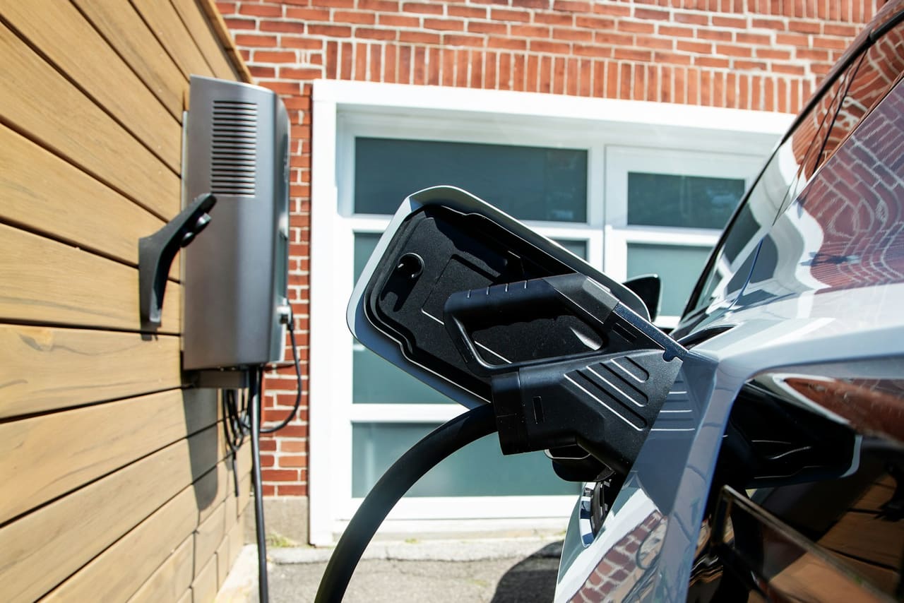 Home EV charger installation on house exterior