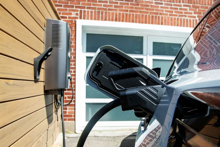 Home EV charger installation on house exterior